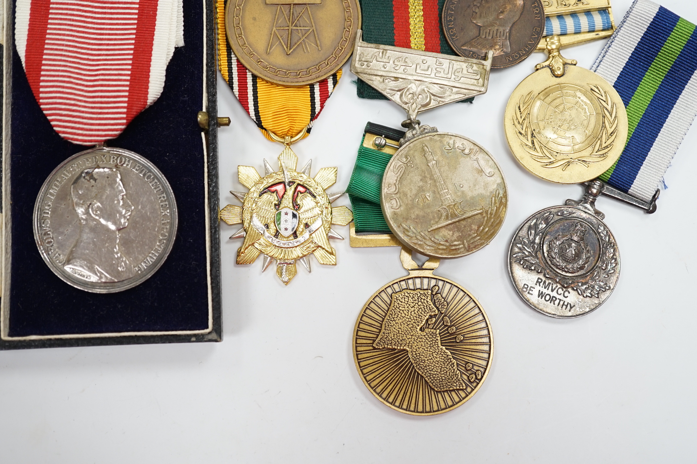 Thirty world military and commemorative medals including; a Belgium War Aid Medal 1914-18, Nigeria Republic Medal, Austri-Hungarian Medal for Bravery, Kuwaiti Liberation Medal, Pakistan Resolution Day Medal, etc.